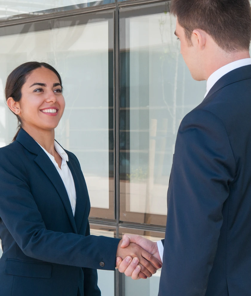 Business professionals beginning a compliance partnership